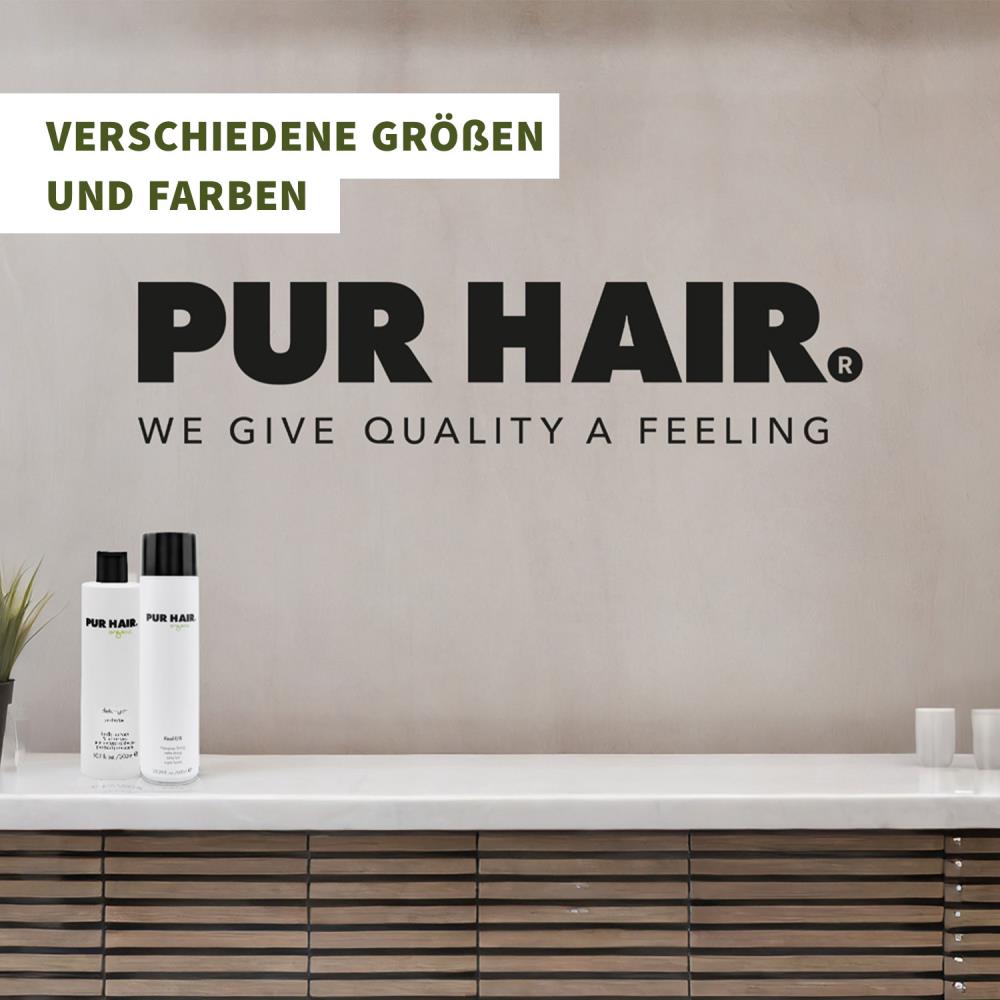 Großes schwarzes PUR HAIR Wandlogo mit Schriftzug „We Give Quality A Feeling“