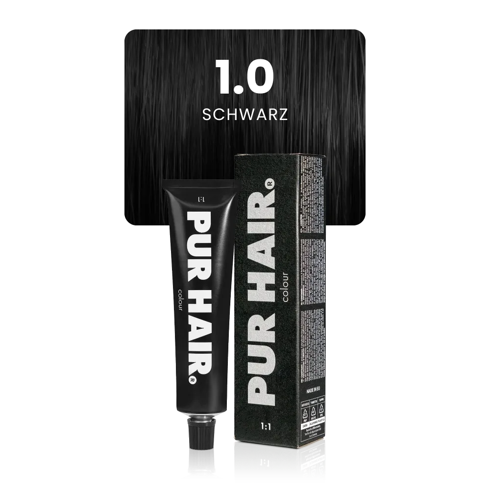 1.0 Schwarz mit schwarzer Farbtube und schwarzer Verpackung vor einer intensiv schwarzen Haarsträhne