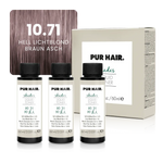 Drei weißen 60-ml-Flaschen, beiger Produktverpackung und kühler aschig-roséblonder Haarfarbsträhne.