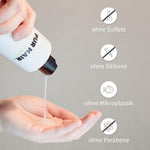 Hand drückt weißes Moisture Shampoo aus der Flasche in die Handfläche.