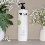PUR HAIR Organic Moisture Treatment, 1000 ml Flasche in Weiß mit schwarzem Pumpspender.